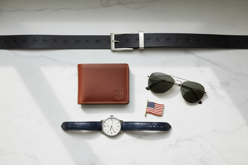 Accessories set: brown leather wallet, star-stamped belt, aviator sunglasses, blue leather strap watch, US flag pin
