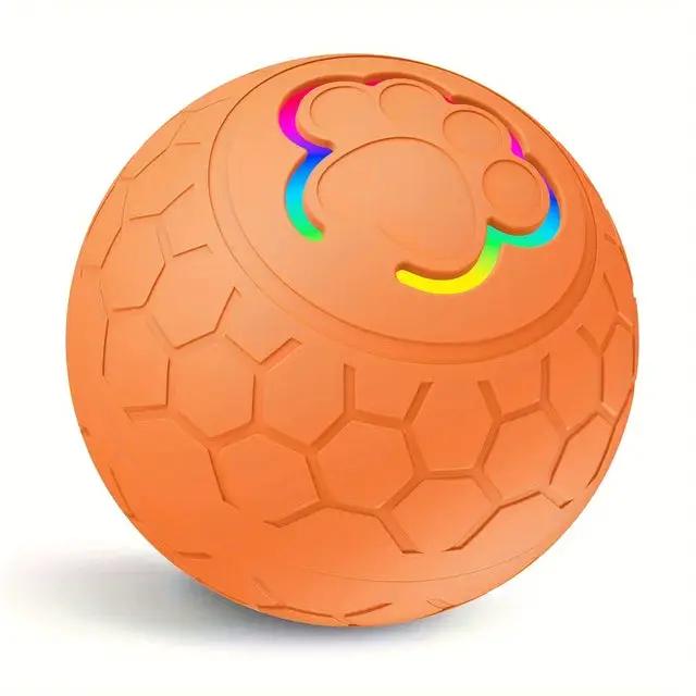 Interactive dog toy ball orange with hexagon-textured surface and LED rainbow paw print cutout