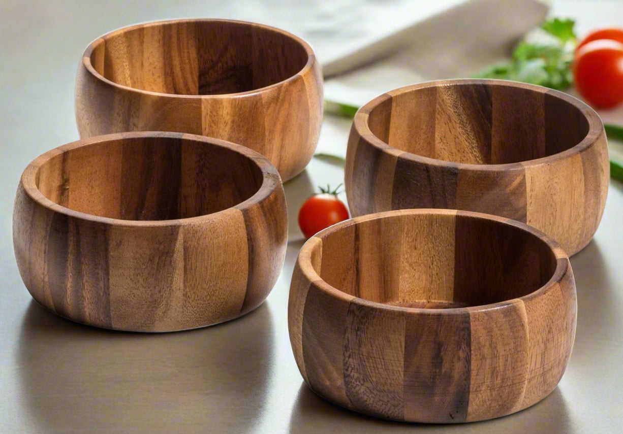 Set of four individual acacia wood salad bowls.