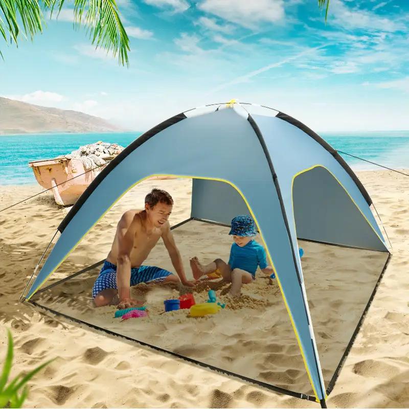 Quick-open beach tent sun shelter on sandy beach, blue-gray, 3-vented pop-up design by V.I.P Digital Presence