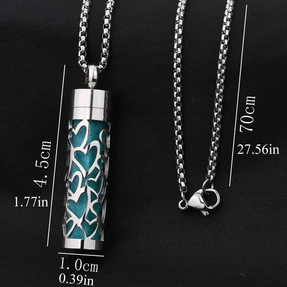Scent Necklace by ViralGalleria.com; silver cylindrical pendant with teal heart-cutout lattice on a 70cm chain.