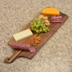 Acacia wood charcuterie board showing natural grain pattern.