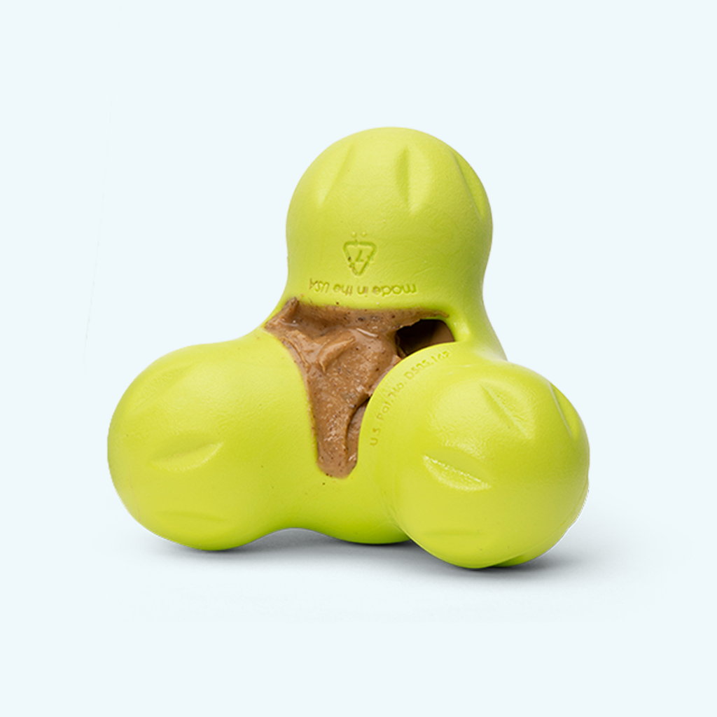 Creamy peanut butter and banana dog treat squeezed onto a lick mat.