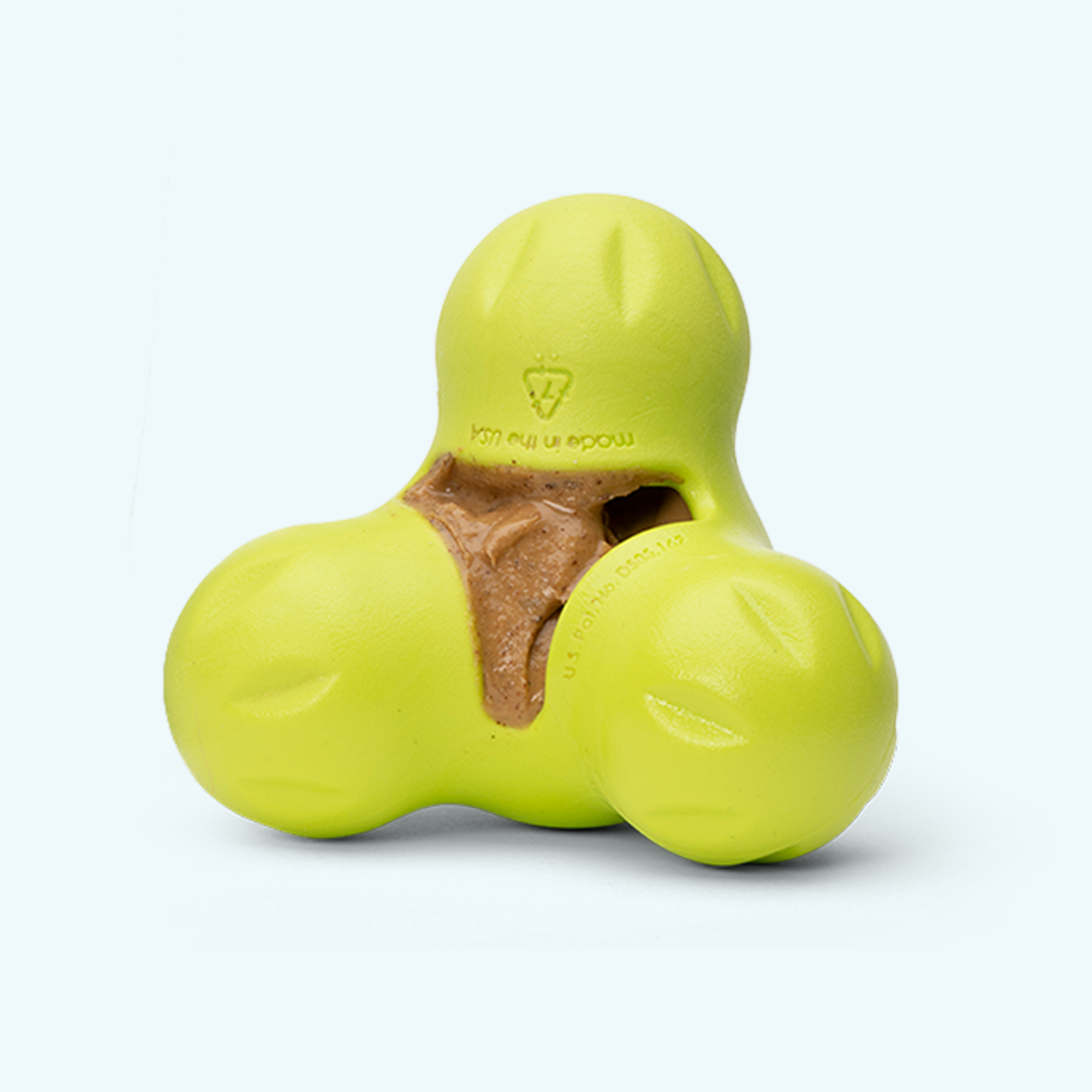 Creamy peanut butter and banana dog treat squeezed onto a lick mat.
