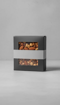 Stateside Nova mixed nuts box with window, dark gray packaging and light gray band