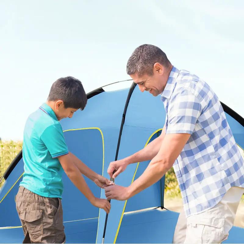 Quick-open beach tent in blue with yellow trim; roomy pop-up sun shelter with 3 vents.