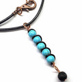 Copper turquoise pendant necklace with lava rock charm on black cord, Alexa Martha Designs