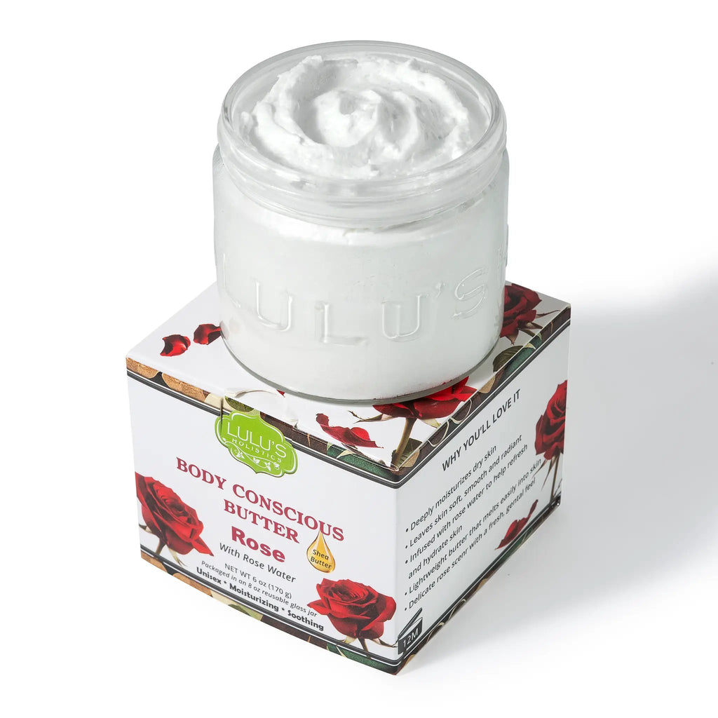 Rosewater Whipped Body Butter by Lulu’s Holistics in a glass jar atop a rose-themed box