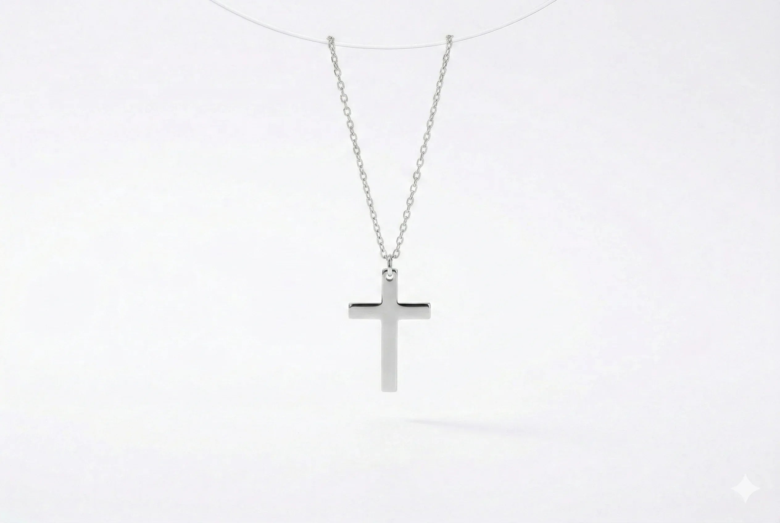 Sterling silver cross necklace in silver, gold, and rose gold finishes.