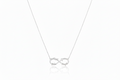 Personalized sterling silver infinity family name necklace.