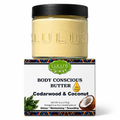 Lulu's Holistics Cedarwood & Coconut Whipped Body Butter in a glass jar with black lid beside its branded box