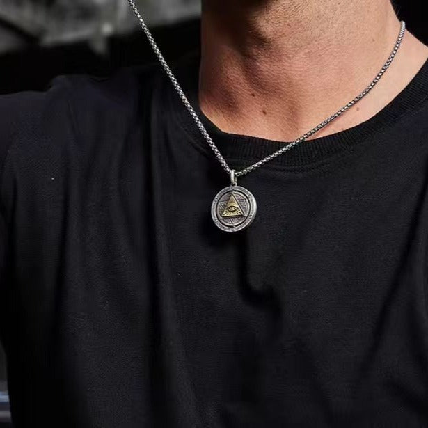 God's Eye Rotatable Pendant on silver-tone chain with round charm and inner triangle eye symbol