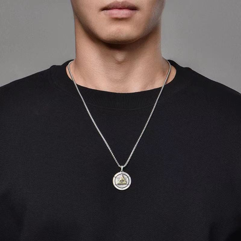 God's Eye Rotatable Pendant on silver-tone chain, circular pendant with inner triangular motif.