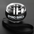 Gyro Ball wrist exerciser for forearm and finger training; black sphere with clear top and attached strap.