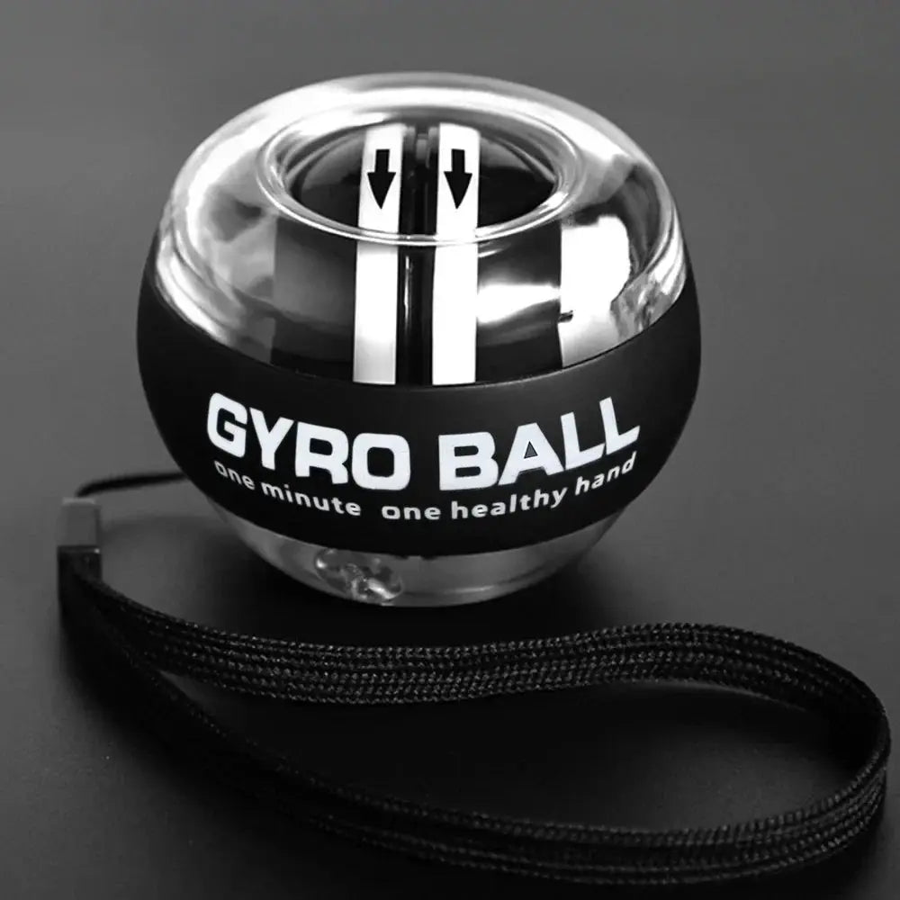 Gyro Ball wrist exerciser for forearm and finger training; black sphere with clear top and attached strap.