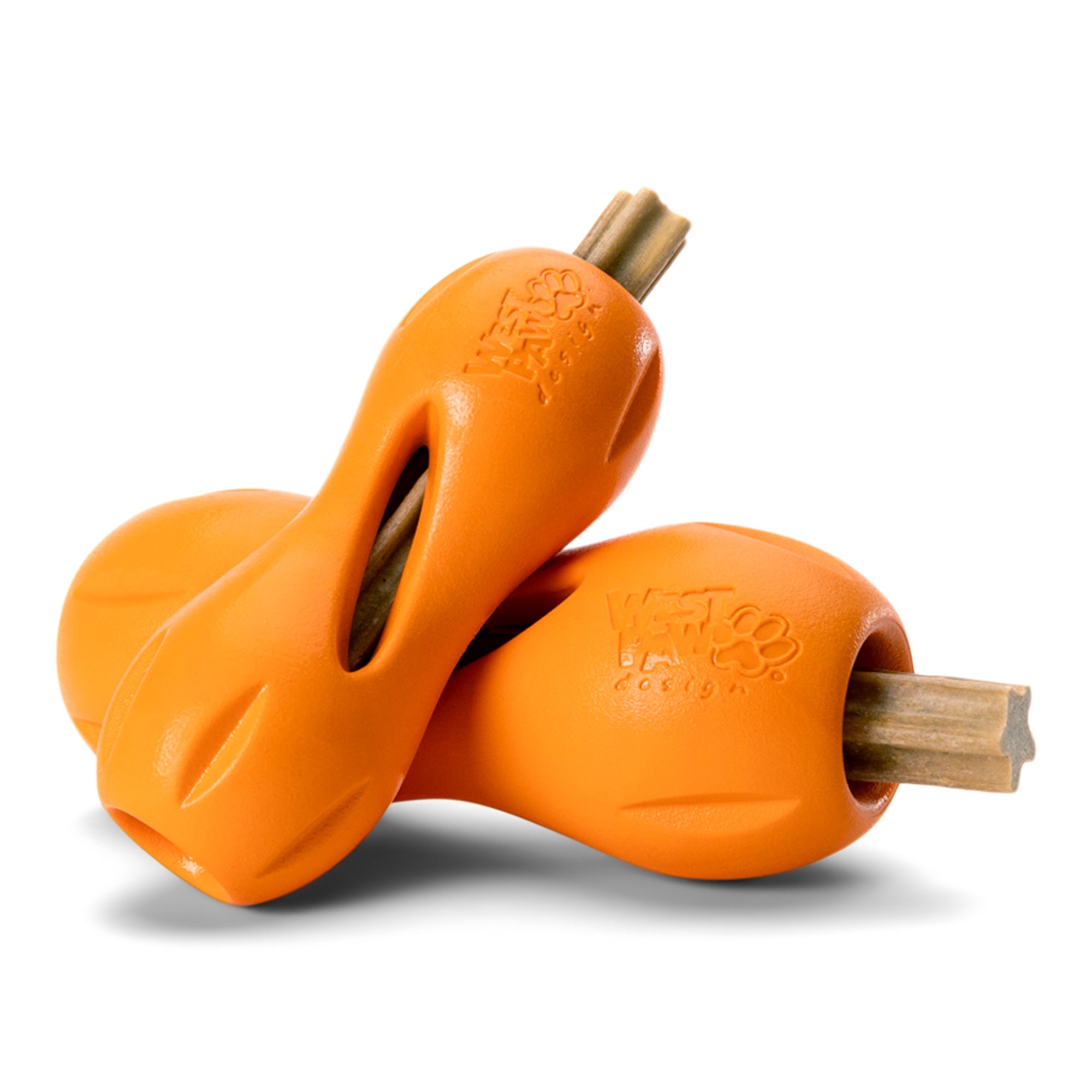 Dog chewing a dental stick loaded in a tangerine Large Qwizl toy.