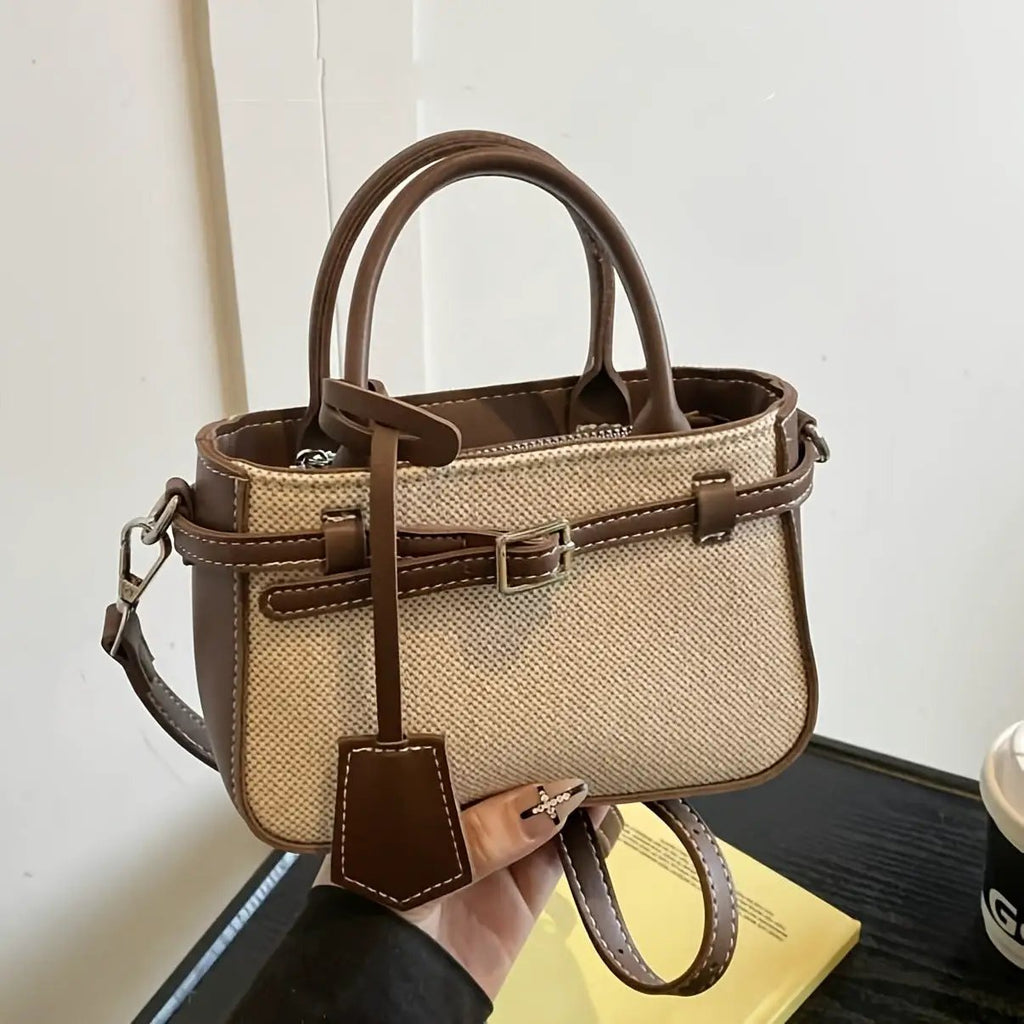 Crossbody tote bag in beige woven fabric with brown leather trim and top handles