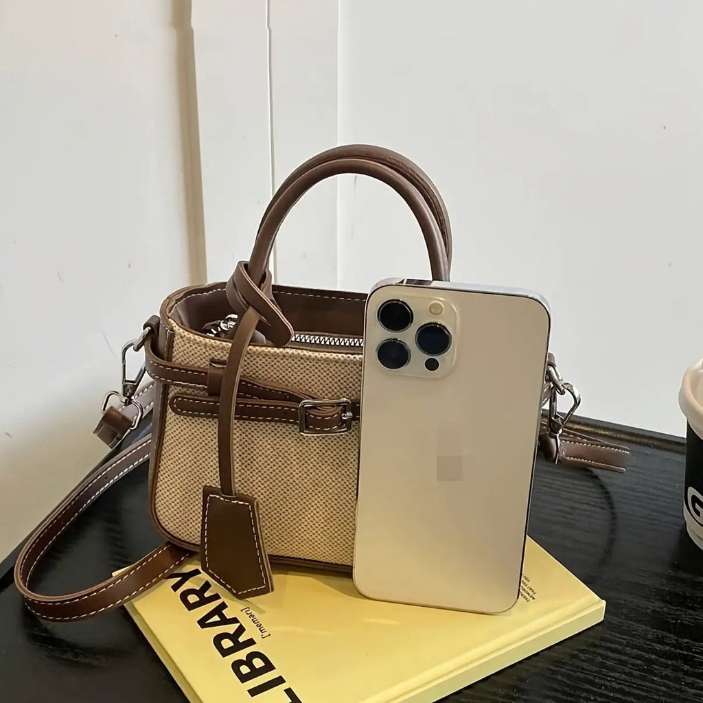 Commuter-friendly crossbody tote by Best YouTube Store; beige canvas with brown leather trim