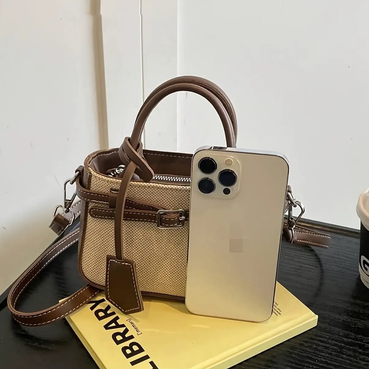 Commuter-friendly crossbody tote by Best YouTube Store; beige canvas with brown leather trim