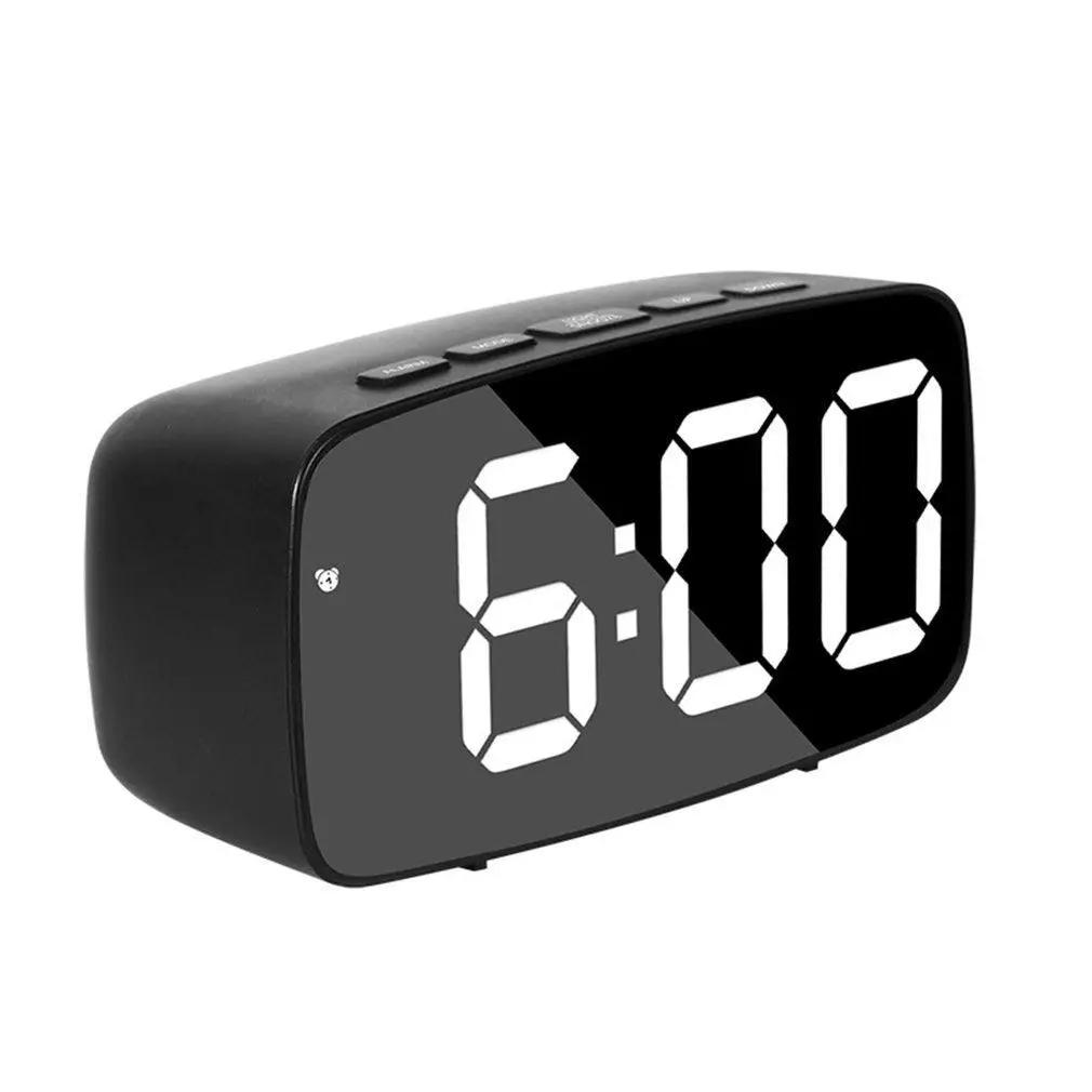 Stevvex digital alarm clock with large LED display, curved black mirror surface, 3-level brightness and dual USB ports.