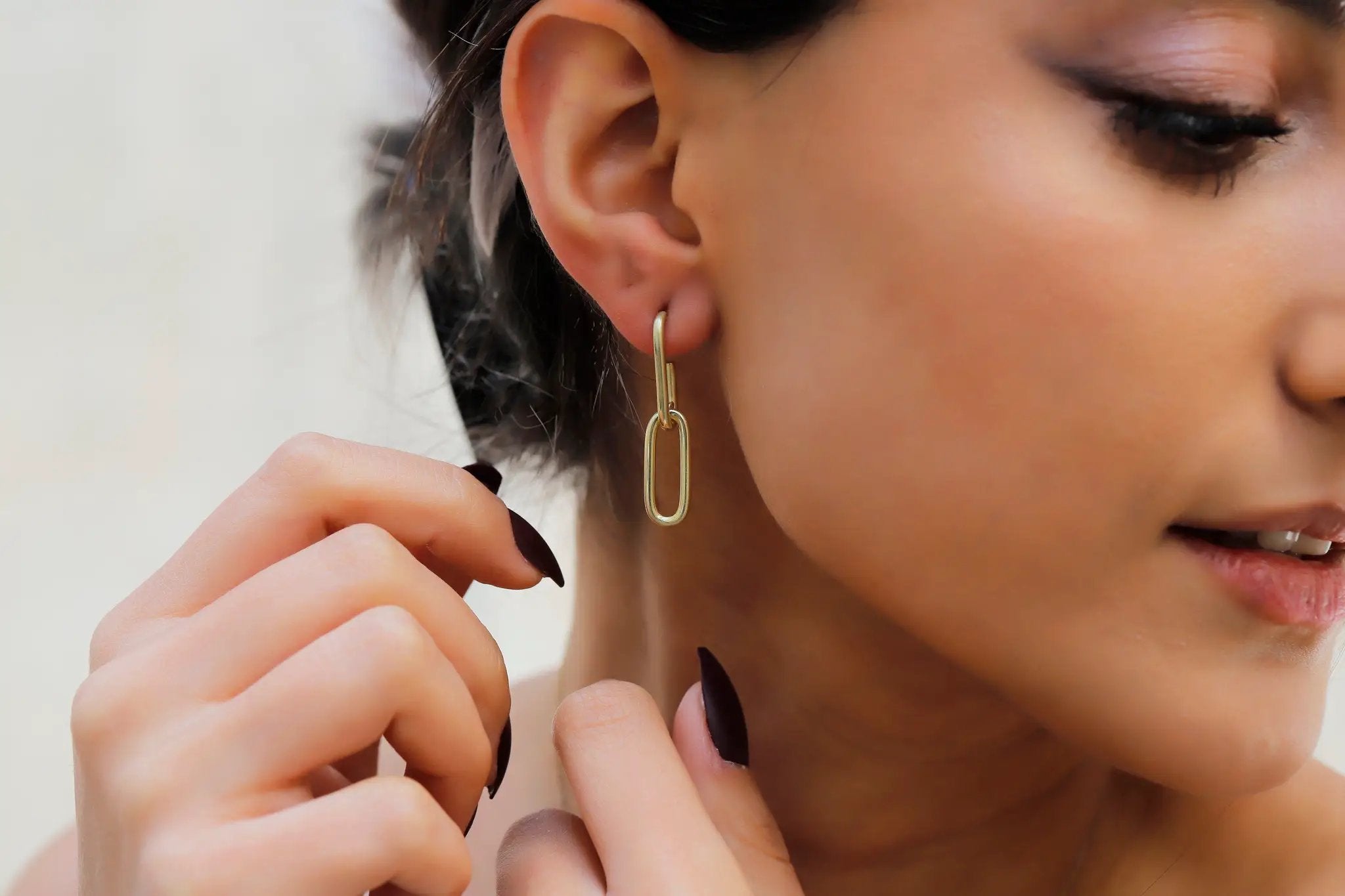 Chunky gold-tone link chain earrings with elongated rectangular links