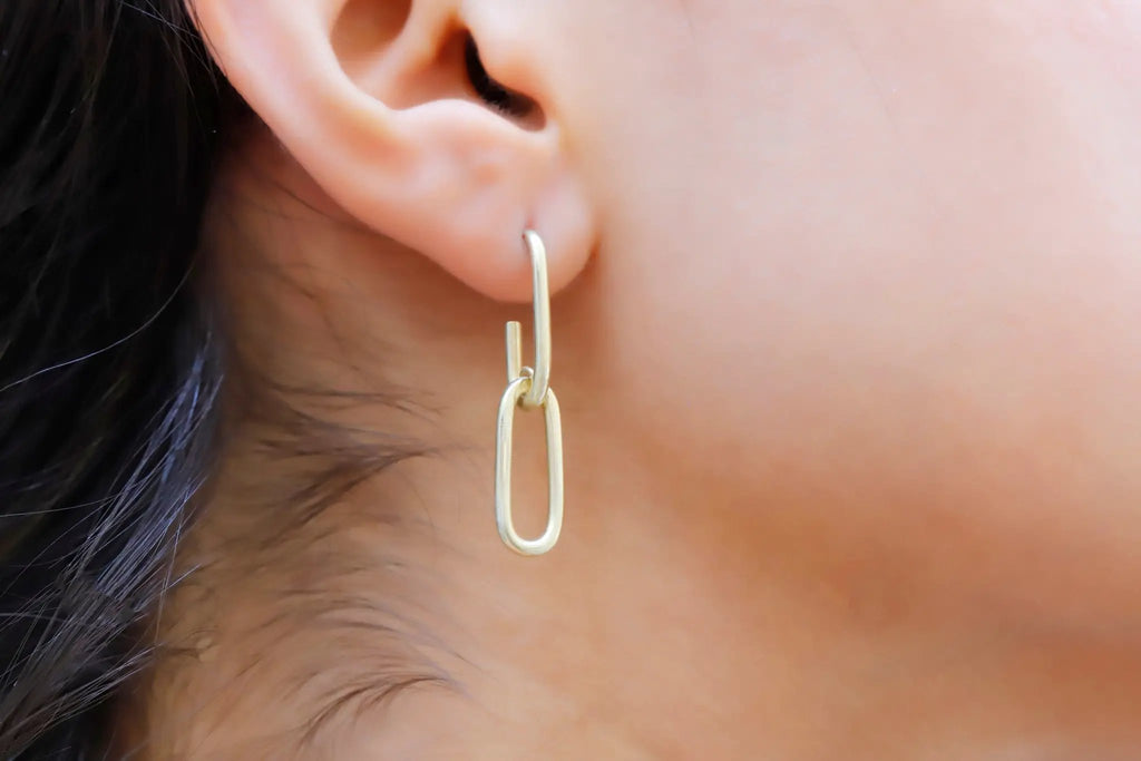 Chunky link chain earring, gold-tone metal with long oval drop design