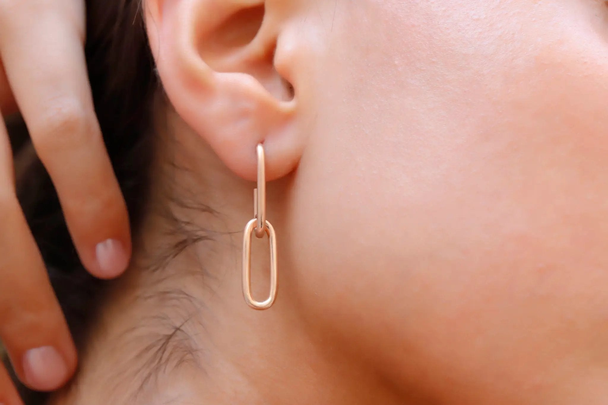 Chunky link chain earrings in rose gold; bold statement jewelry for confident style