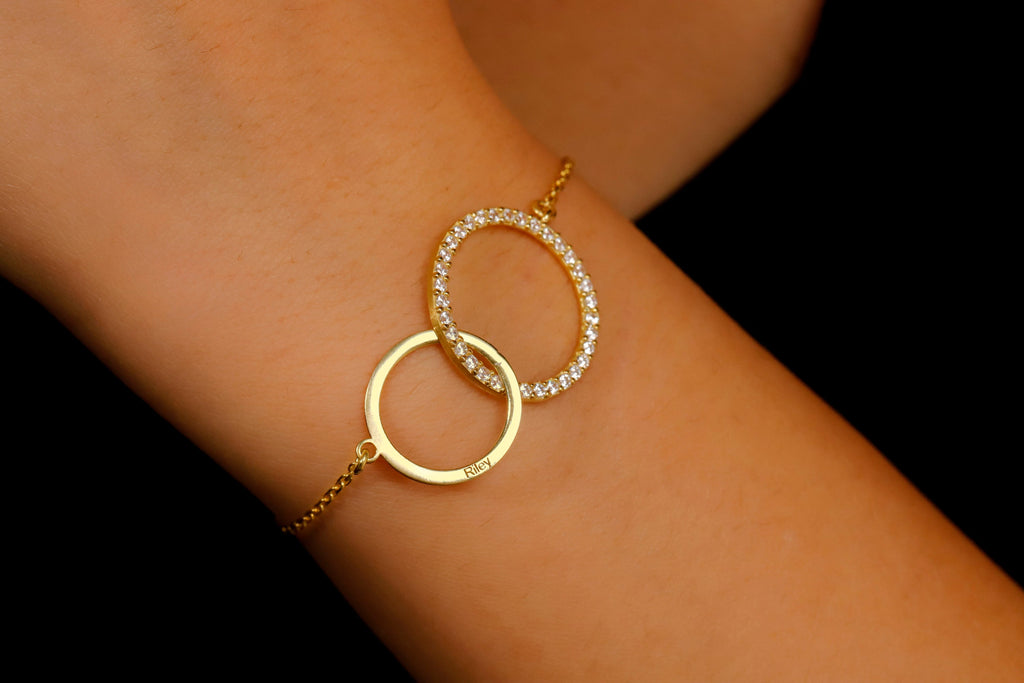 Dainty interlocking sterling silver bracelet with diamonds.