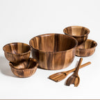 Soro acacia wood large salad bowl with servers and four individual bowls.