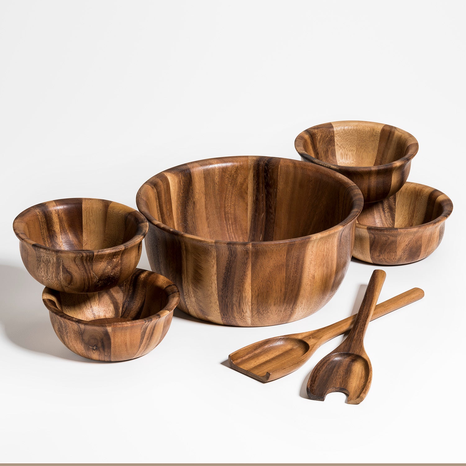 Soro acacia wood large salad bowl with servers and four individual bowls.