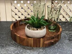Aalborg round acacia serving tray showing wood grain.