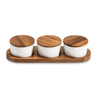 Acacia wood condiment serving set with three lidded ceramic bowls.