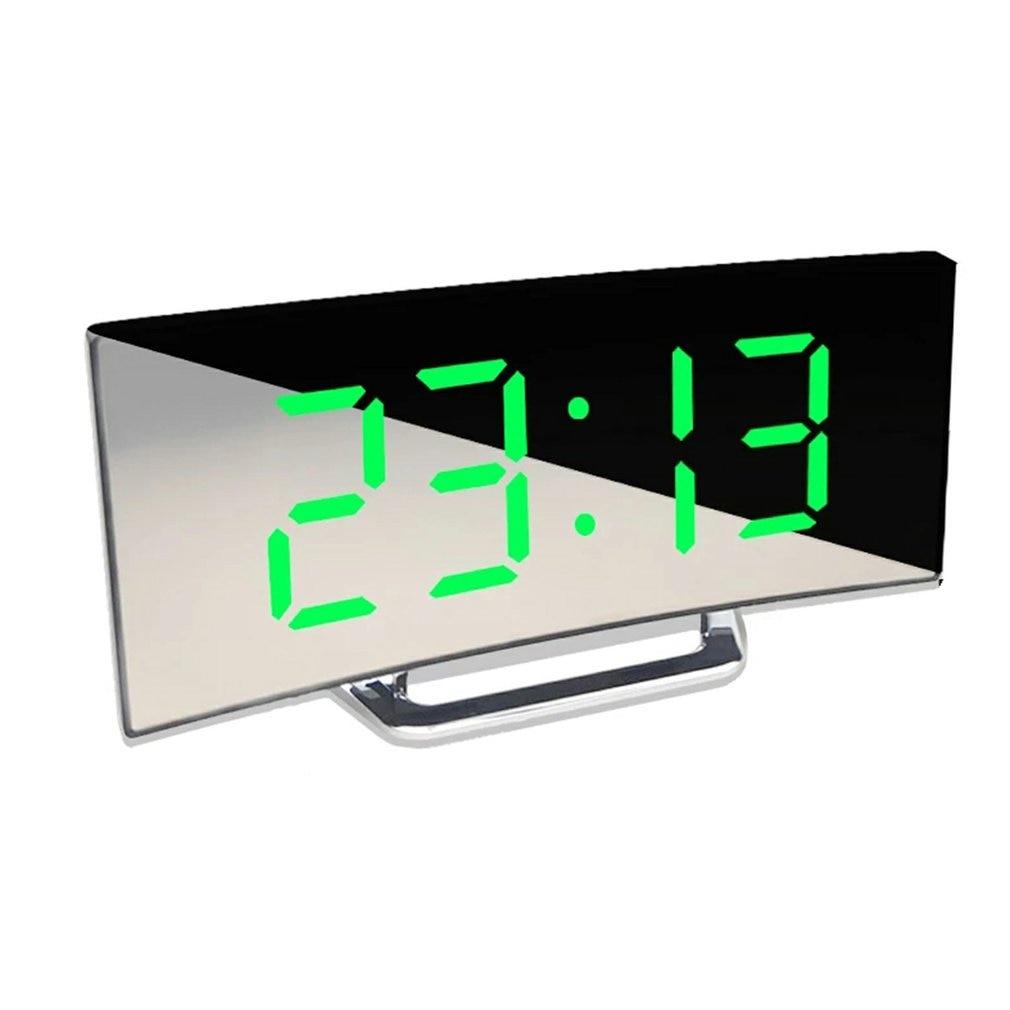 Stevvex digital alarm clock with large green LED display on a mirrored curved surface desk stand