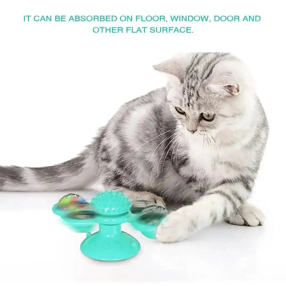 Stevvex rotatable massage cat toy windmill with teal blades and LED ball for interactive play