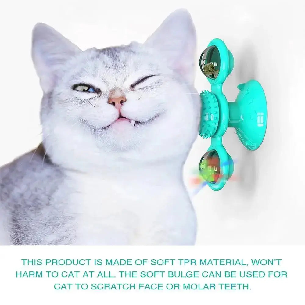 Rotatable Stevvex cat toy with windmill LED ball and teeth-cleaning bristles, turquoise wall-mount play
