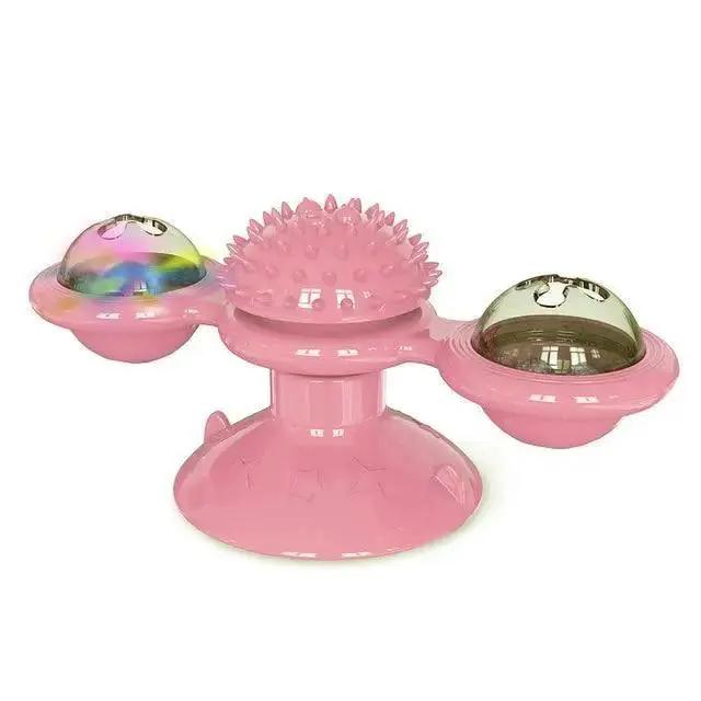 Stevvex pink rotatable cat toy with a spiked massage top and two LED ball pods